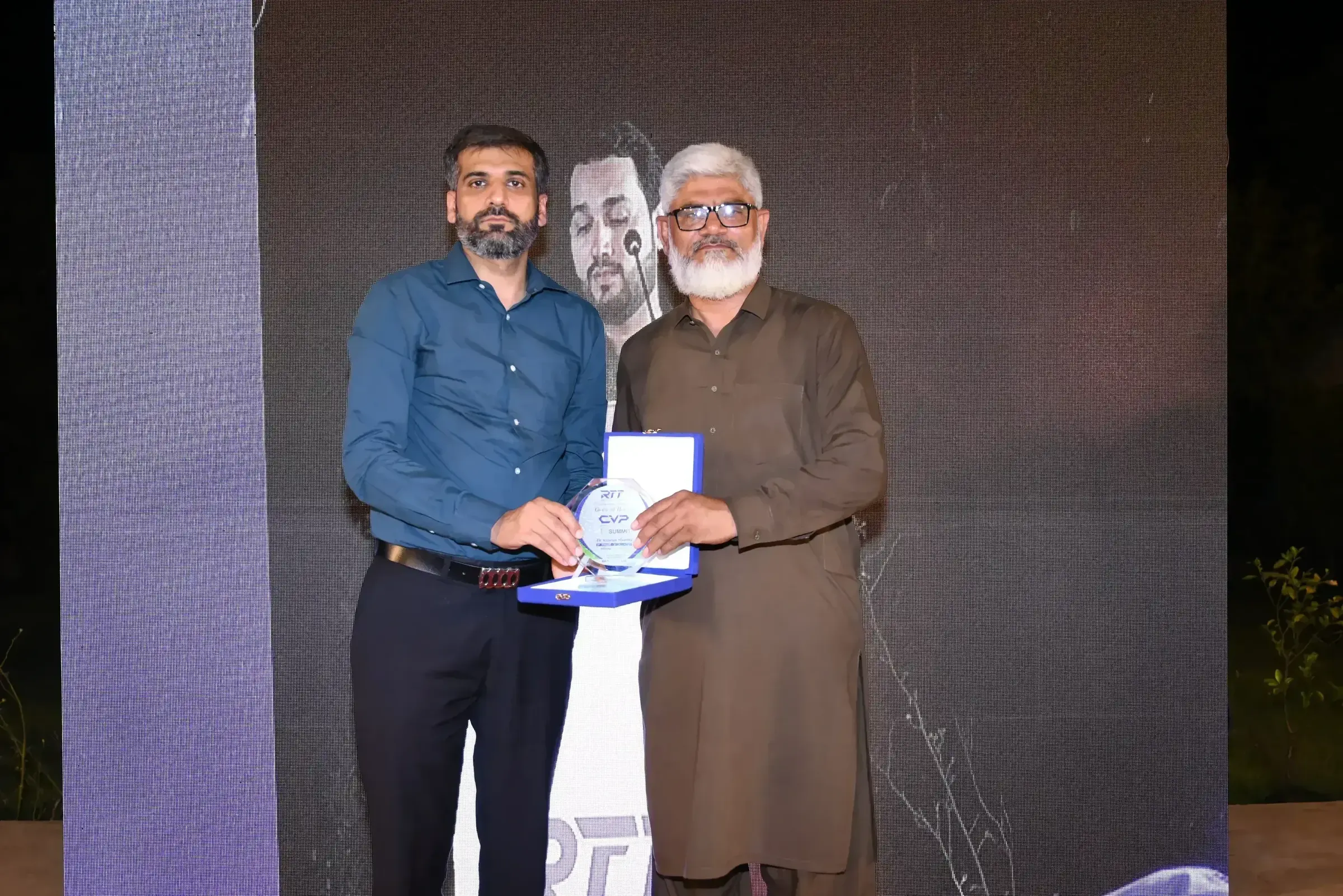 Shield of honour presented to Dr Rizwan Shabbir of GCU Faisalabad
